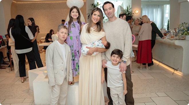 Erin and Abe Lichy with their children at their son's bris celebration