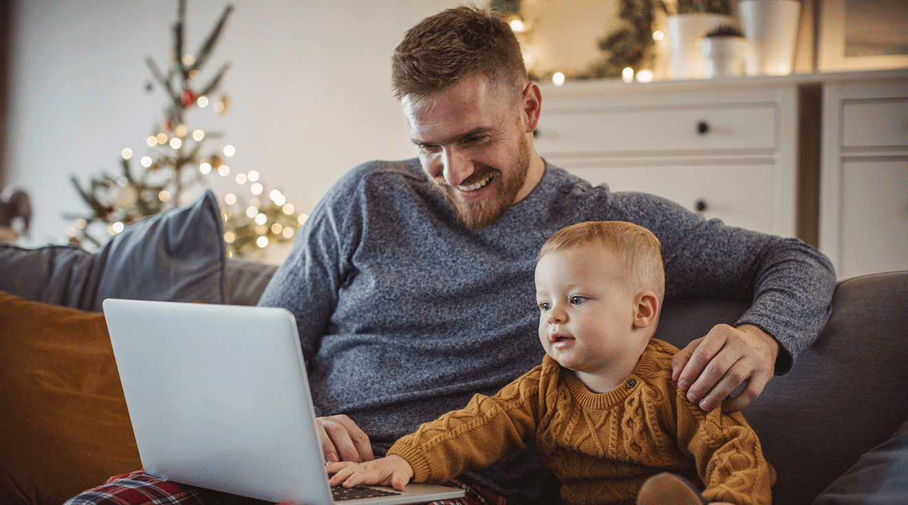 father and baby shopping online during christmas time