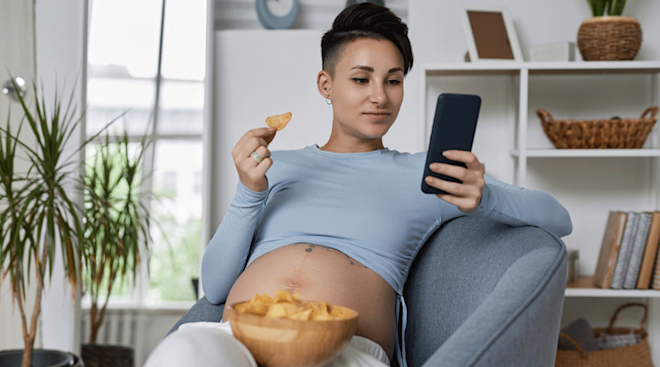 pregnant woman eating potato chips