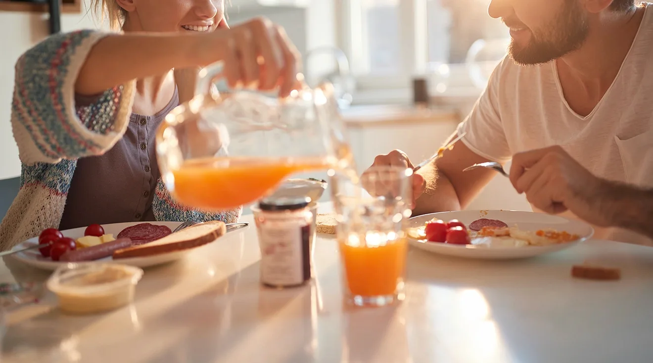 young couple enjoying breakfast at home