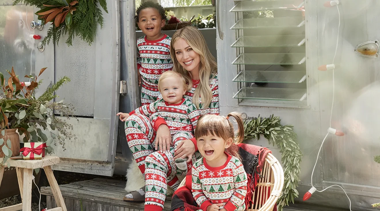 hilary duff wearing holiday pajamas from carter's with children