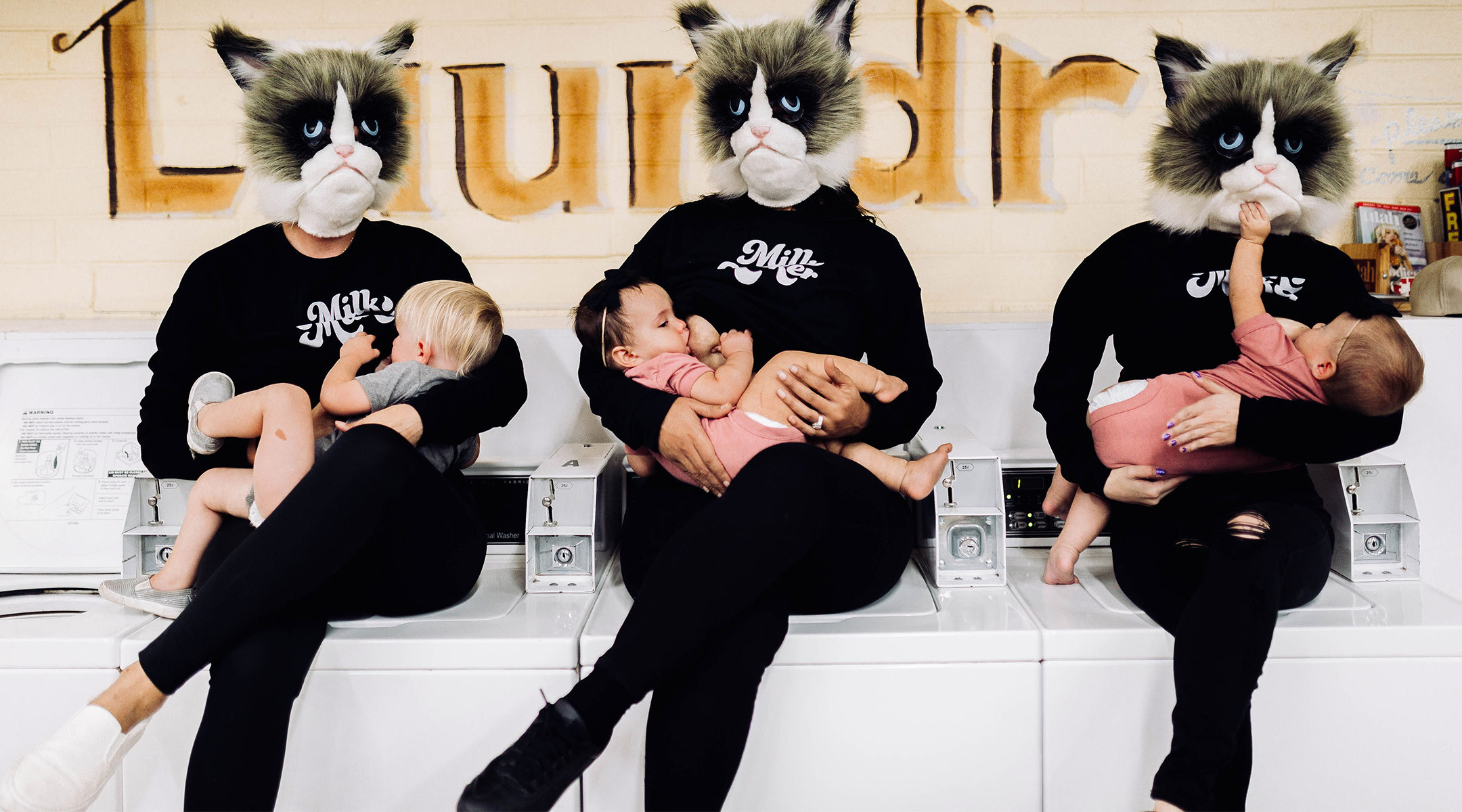 cover up breastfeeding stance image, showing women breastfeeding with cat masks