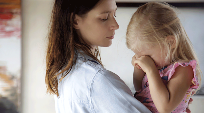 mom comforting frustrated toddler