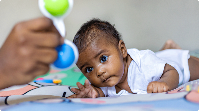 mom playing with baby during tummy time