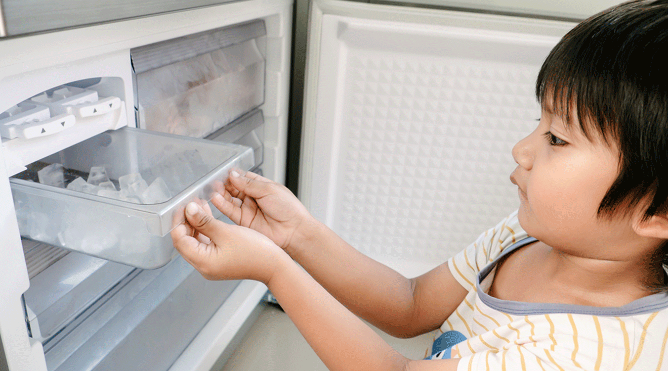 toddler grabbing ice from freezer