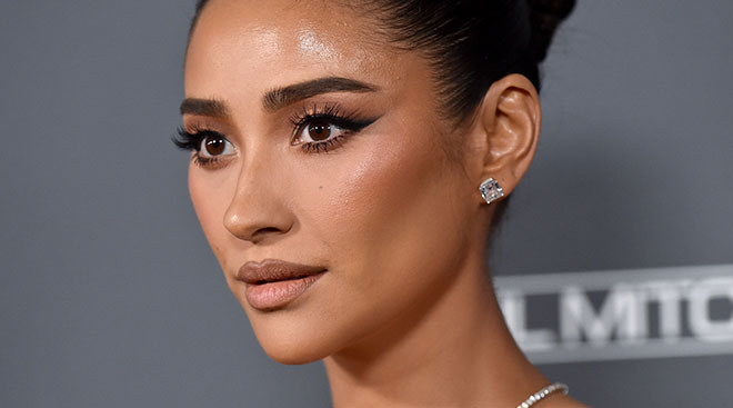 close up headshot of shay mitchell at a red carpet event