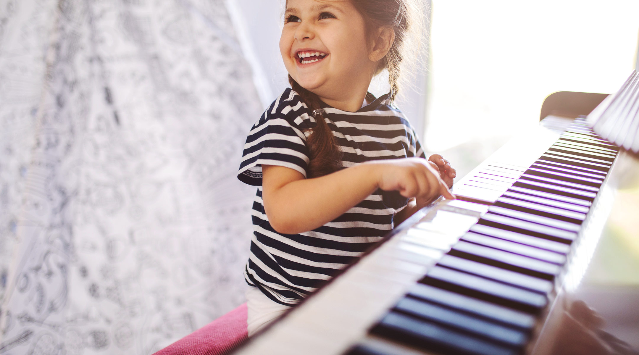 happy little girl mesmerized by her dad's singing