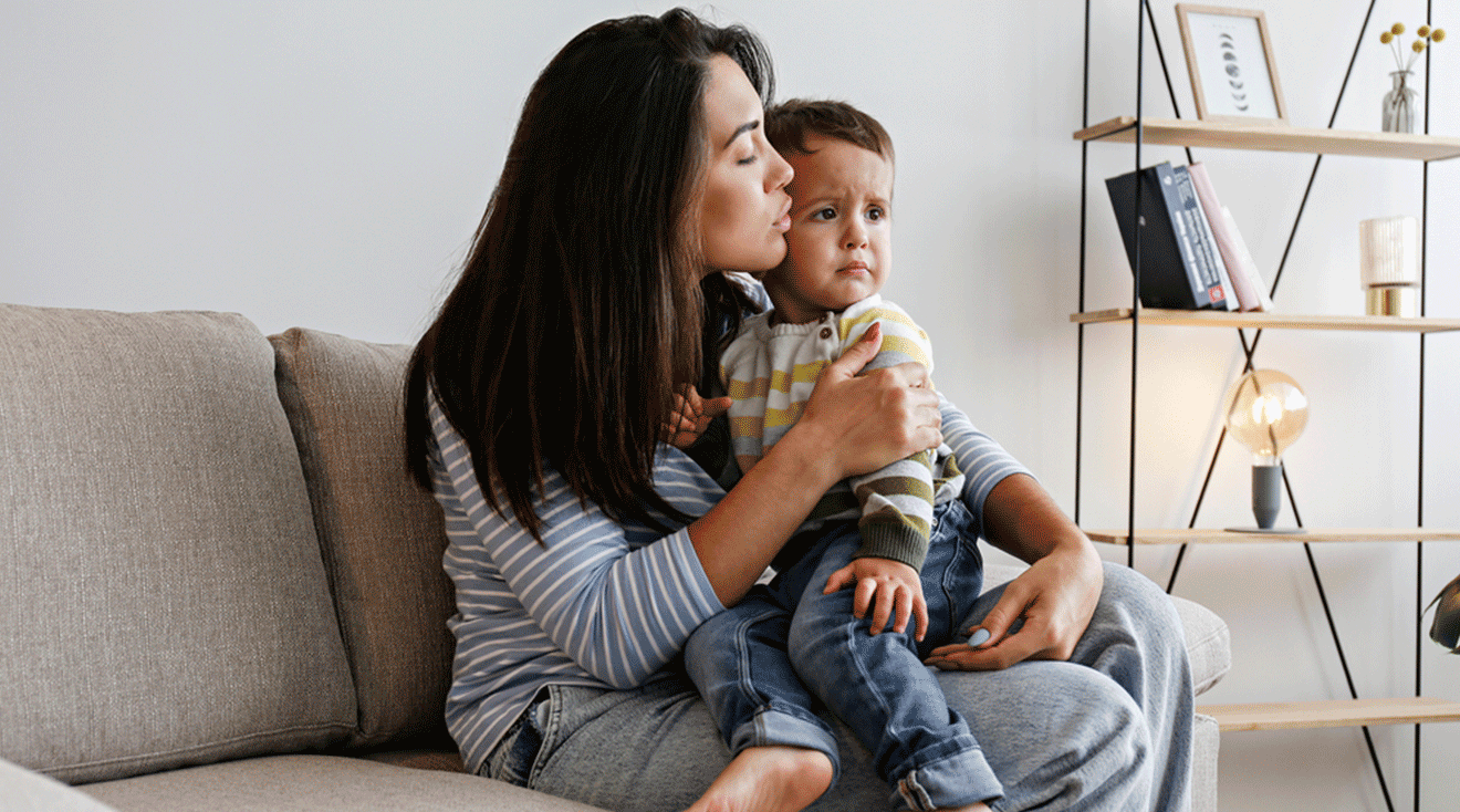 mom calming toddler down during tantrum