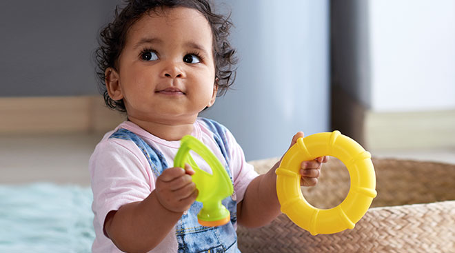 baby playing with ring toy