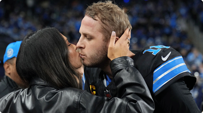 Jared Goff #16 of the Detroit Lions receives a kiss from his wife, Christen Harper Goff on field prior to the game against the Buffalo Bills at Ford Field on December 15, 2024 in Detroit, Michigan
