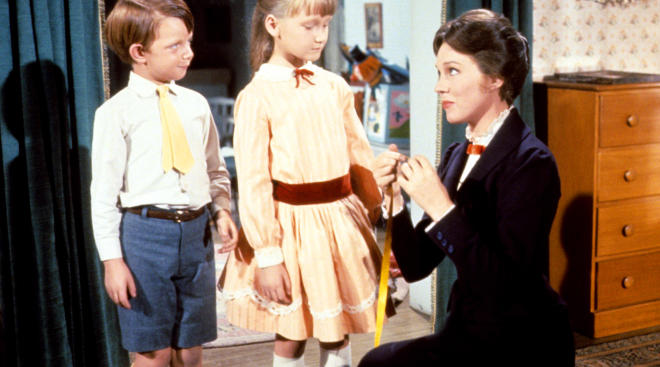 a picture of two children with Mary Poppins from the classic movie