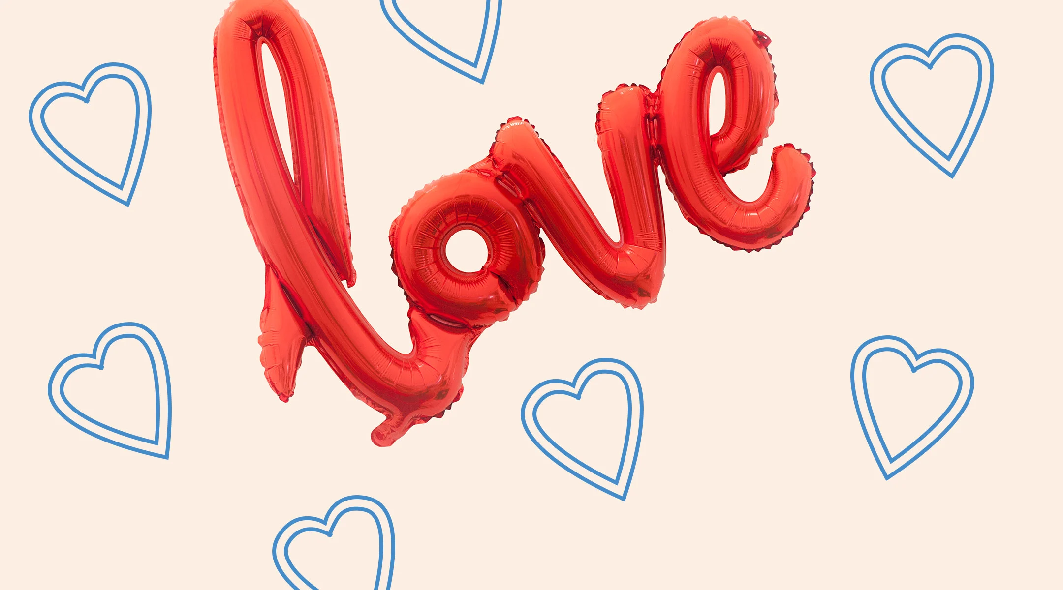 red balloon letters that spell out love with collage of blue hearts