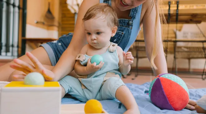 mom and baby playing with sensory toys