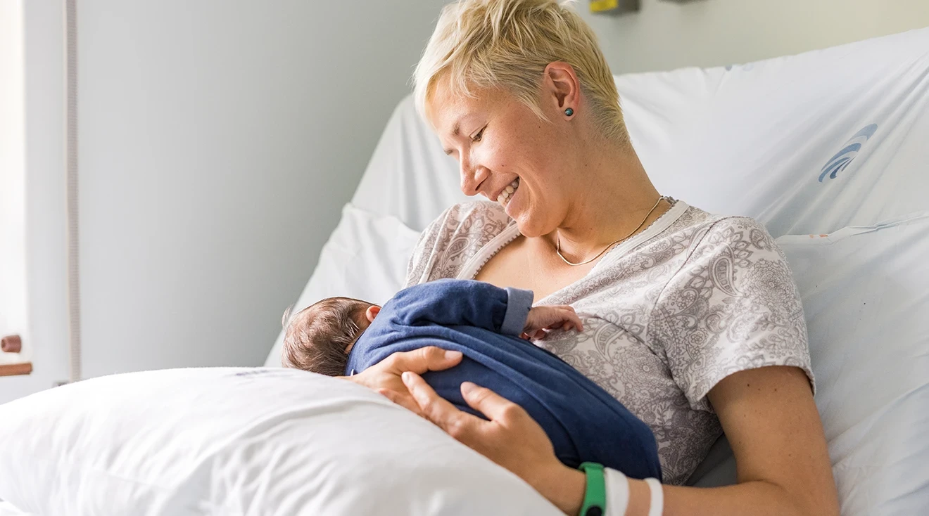 Newborn baby resting on mother's chest after labor and delivery