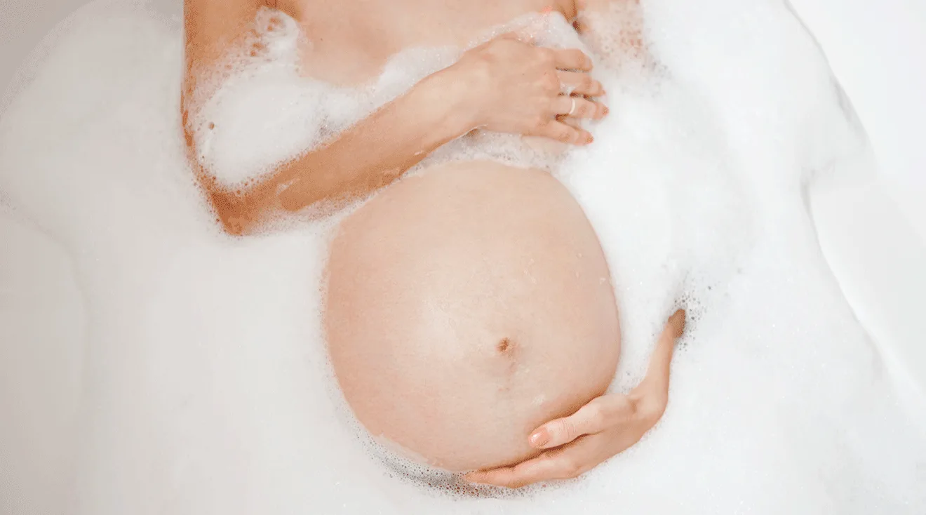 pregnant woman taking a bath