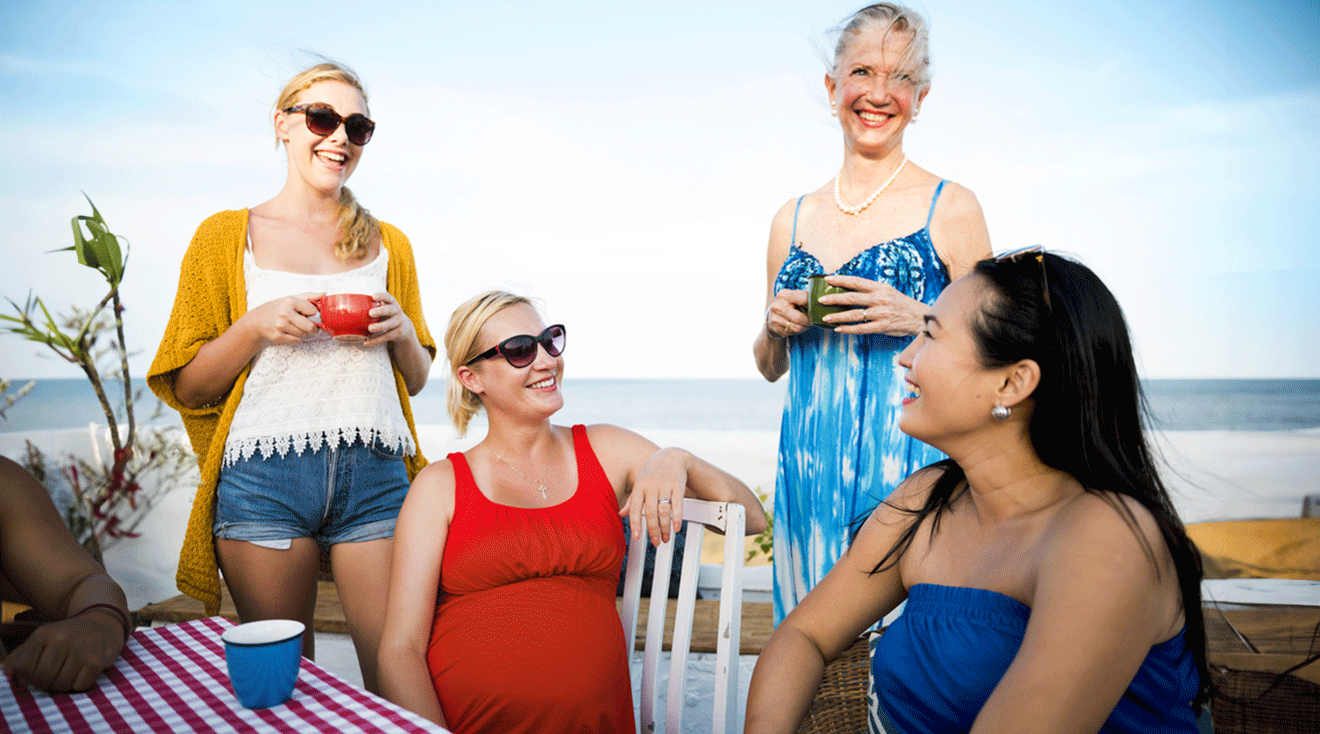 pregnant woman enjoying vacation with friends