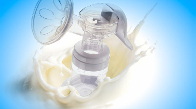 breast milk pump in milk splash background