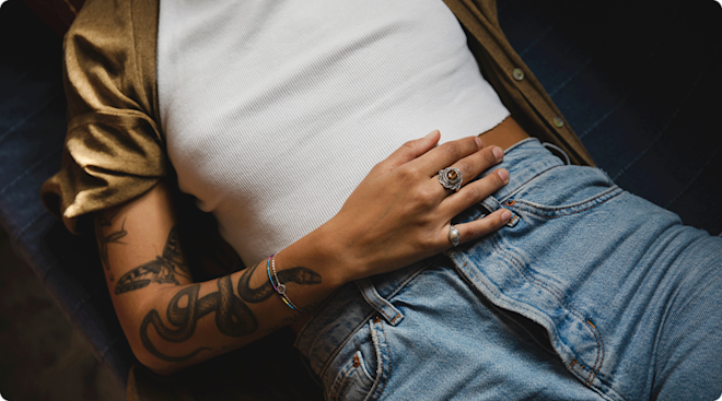 woman lying down with hand on stomach