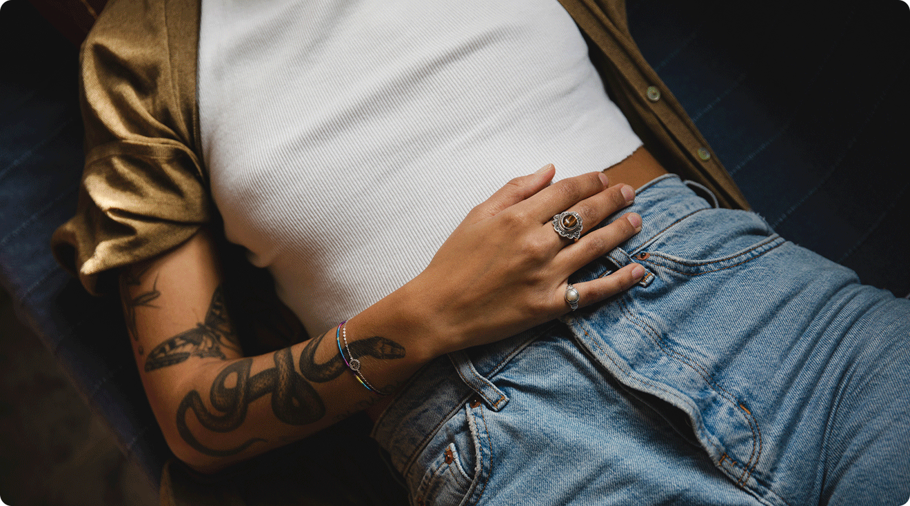 woman lying down with hand on stomach
