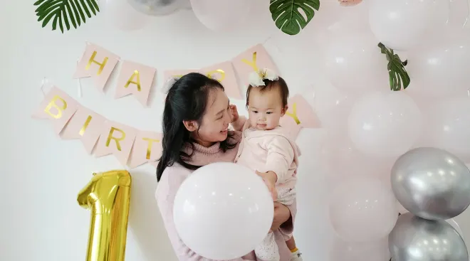 mother celebrating baby's first birthday party