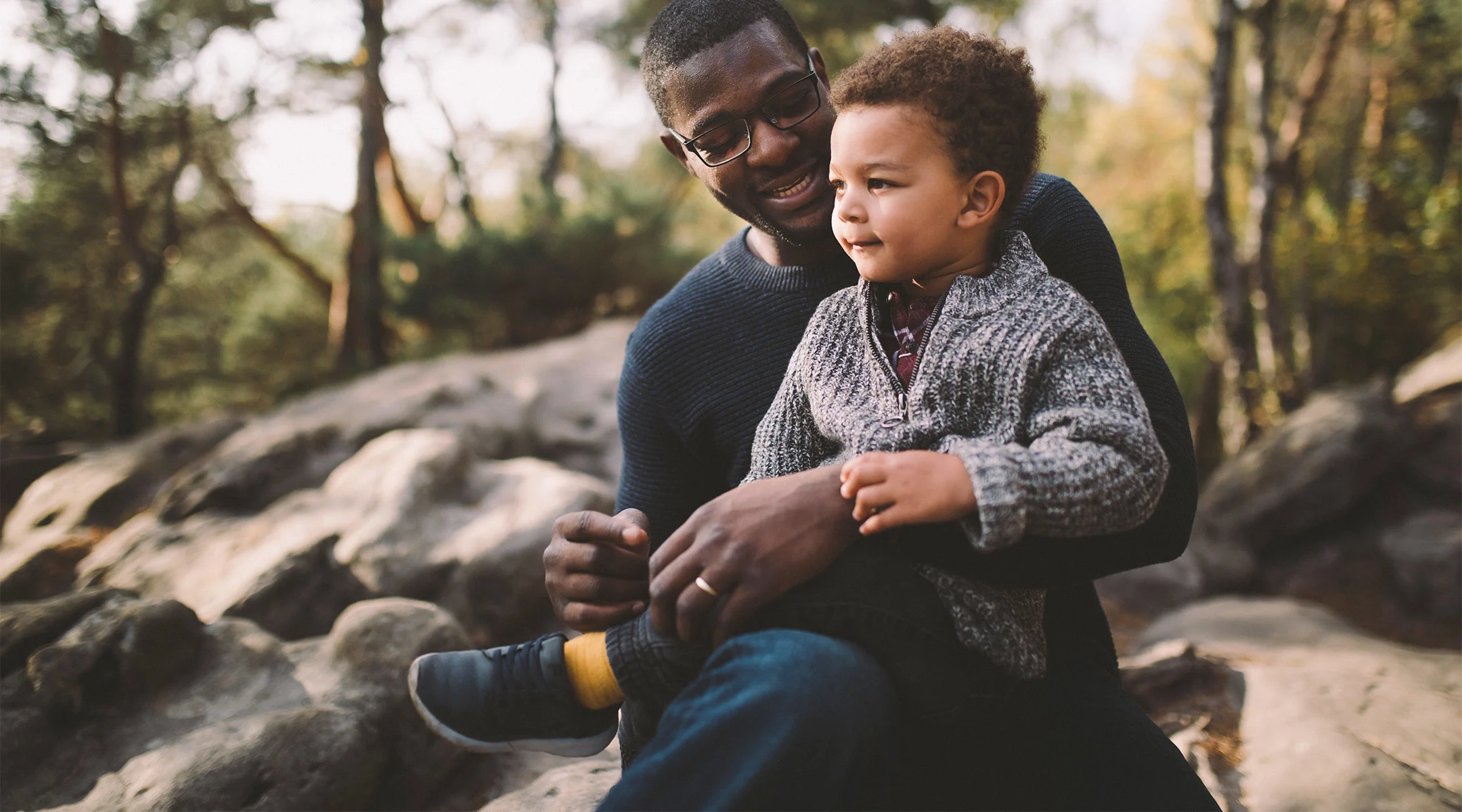 dad speaking to young son about serious topic