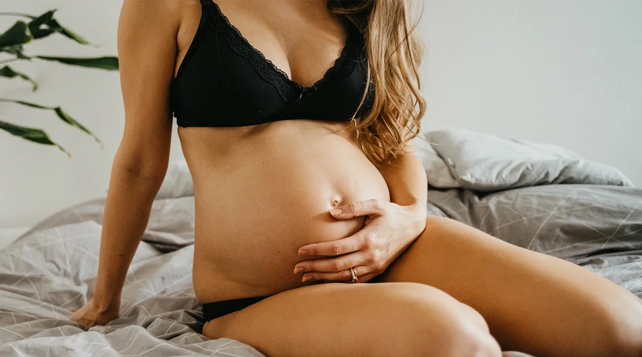 pregnant woman wearing maternity lingerie