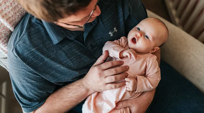 dad holding his new baby