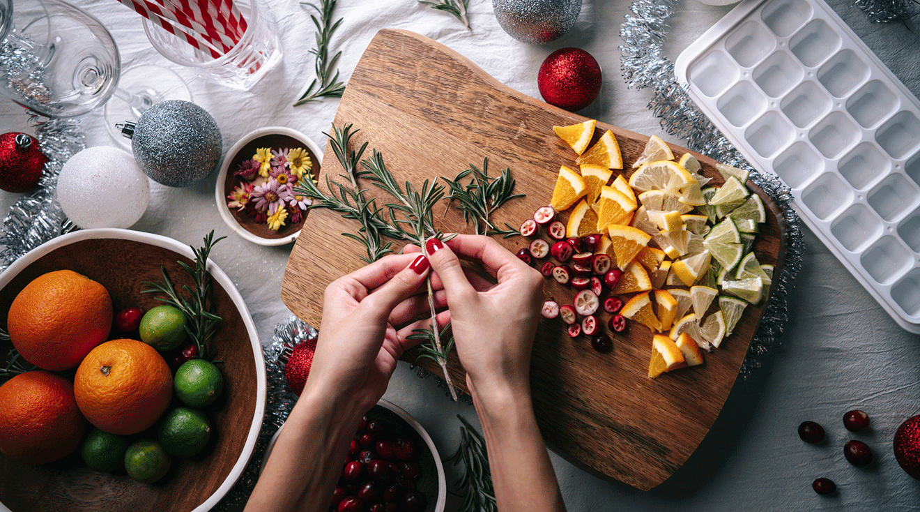 woman making festive holiday drinks in kitchen