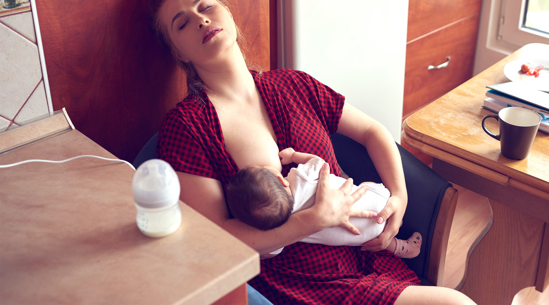 mom who has fallen asleep while breastfeeding
