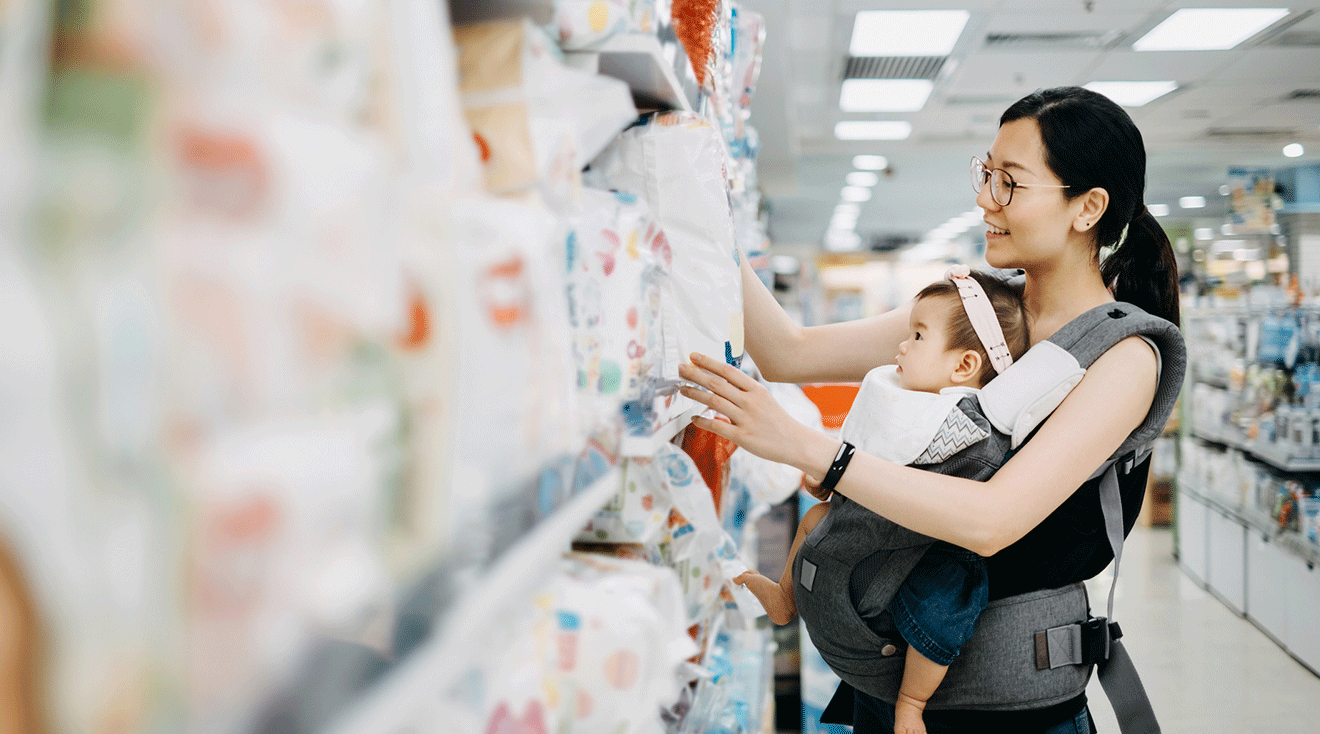 mom shopping for diapers with baby