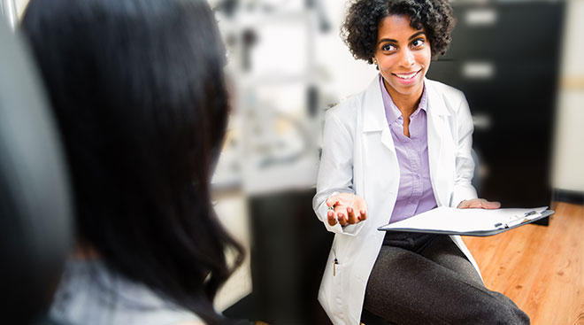 doctor and patient sitting and discussing medical matters