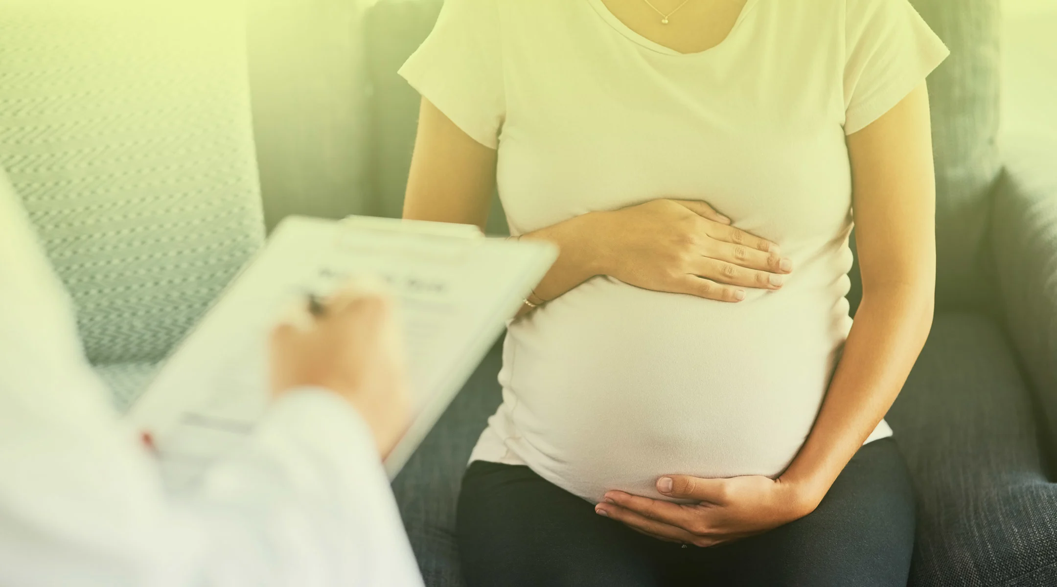 pregnant woman sitting at doctor's office
