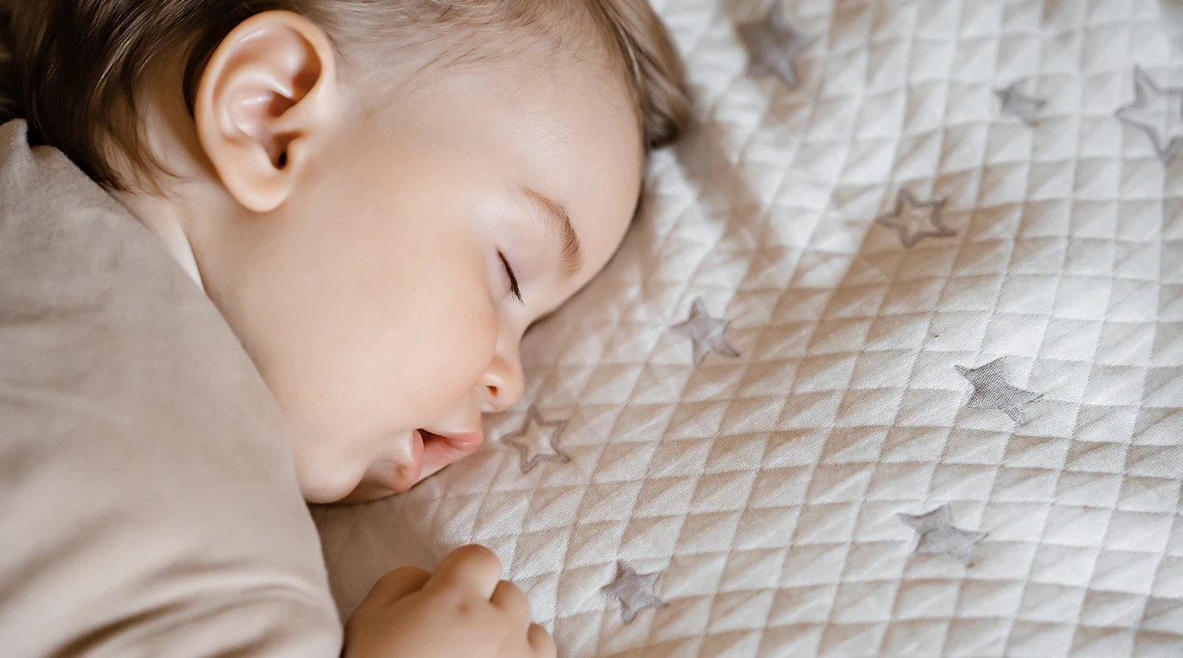 When Can Baby Sleep On Stomach Hero Shutterstock 2157483495.webp?q=90