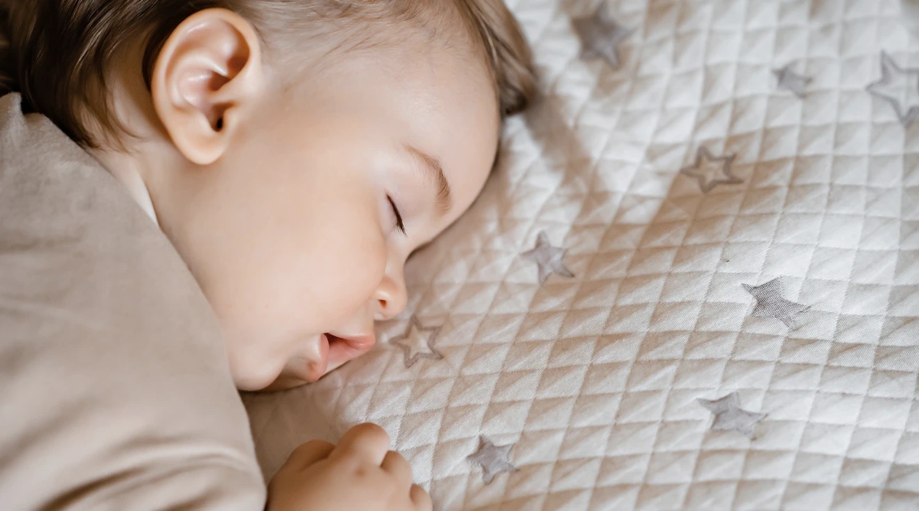 1 year old baby sleeping on stomach