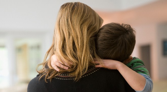 mom hugging young child