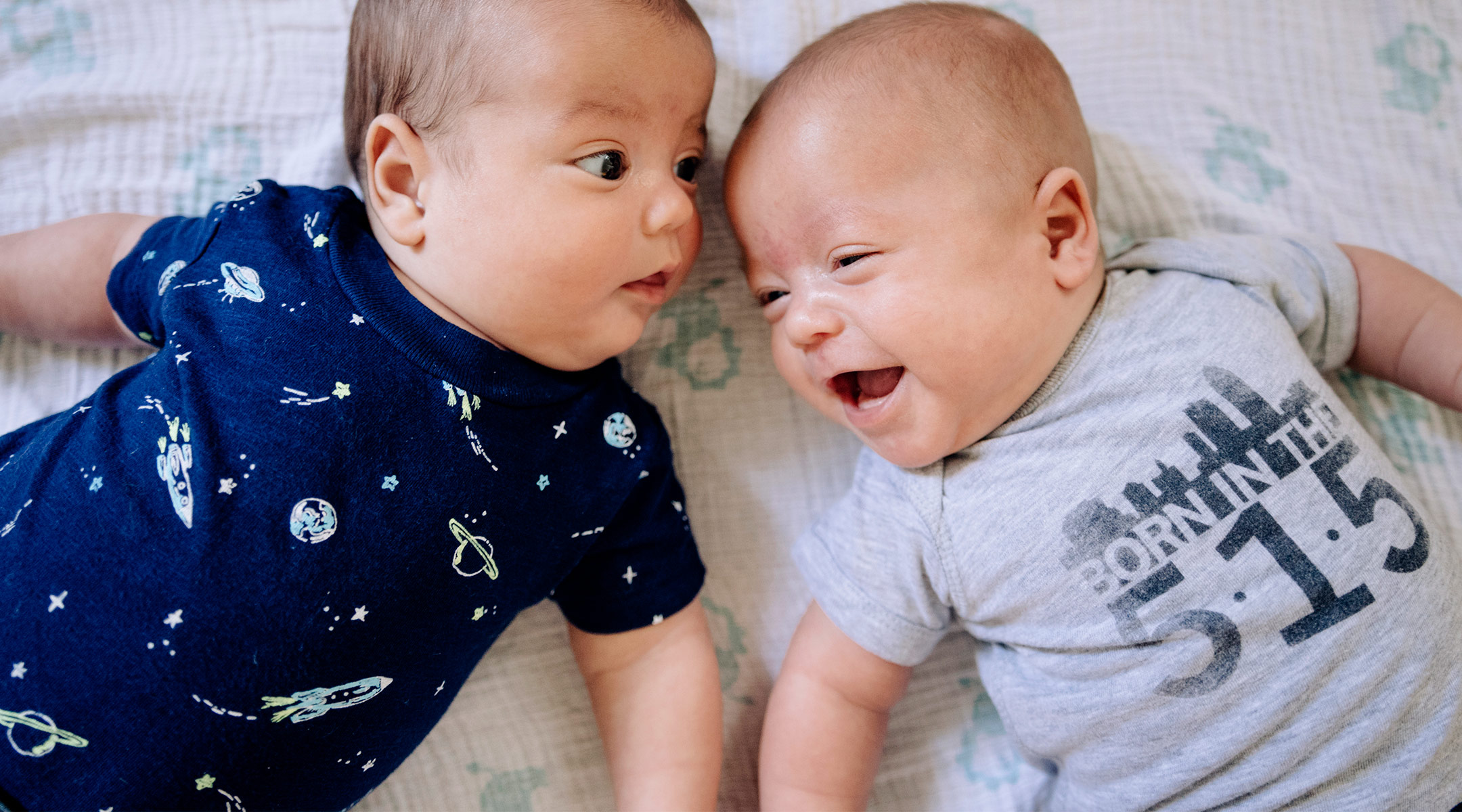 baby twins interacting with each other
