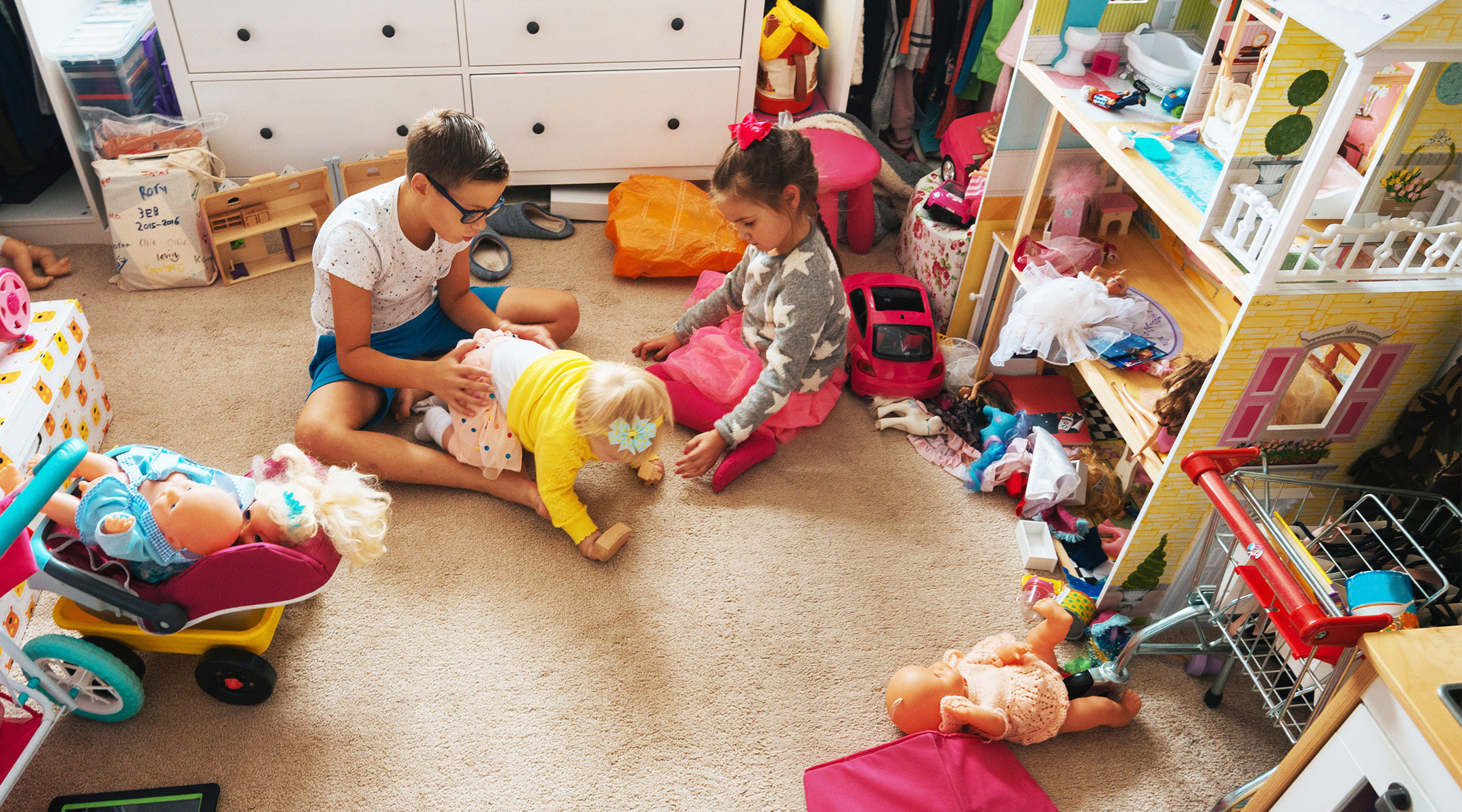 young children play in messy house