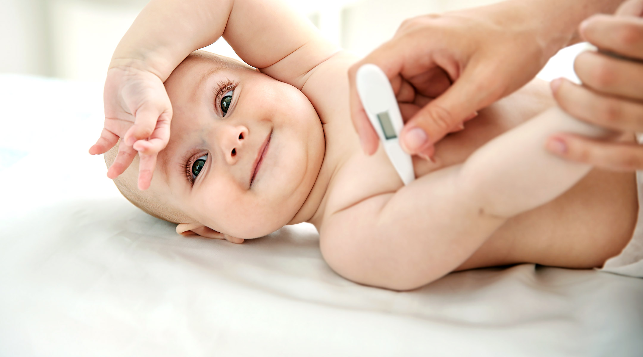 baby with thermometer