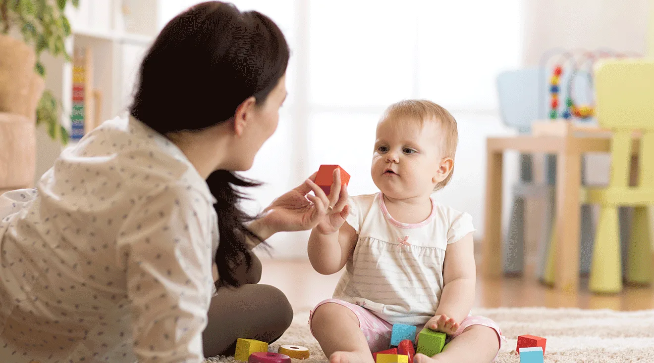 nanny playing with baby