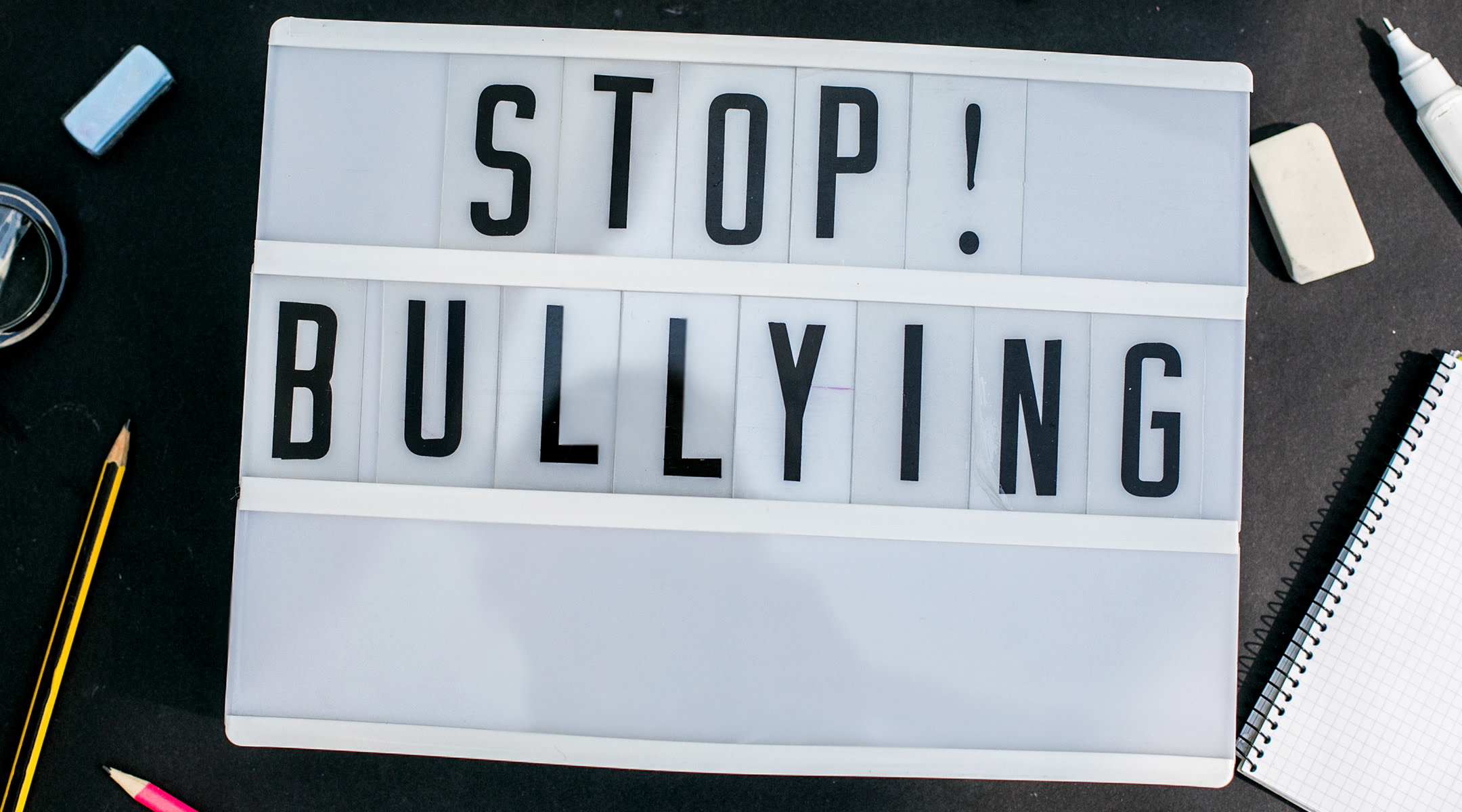 letterboard backlit sign that says stop bullying