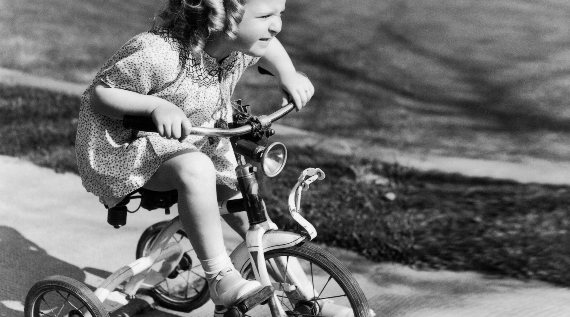 little girl with grit riding her bike