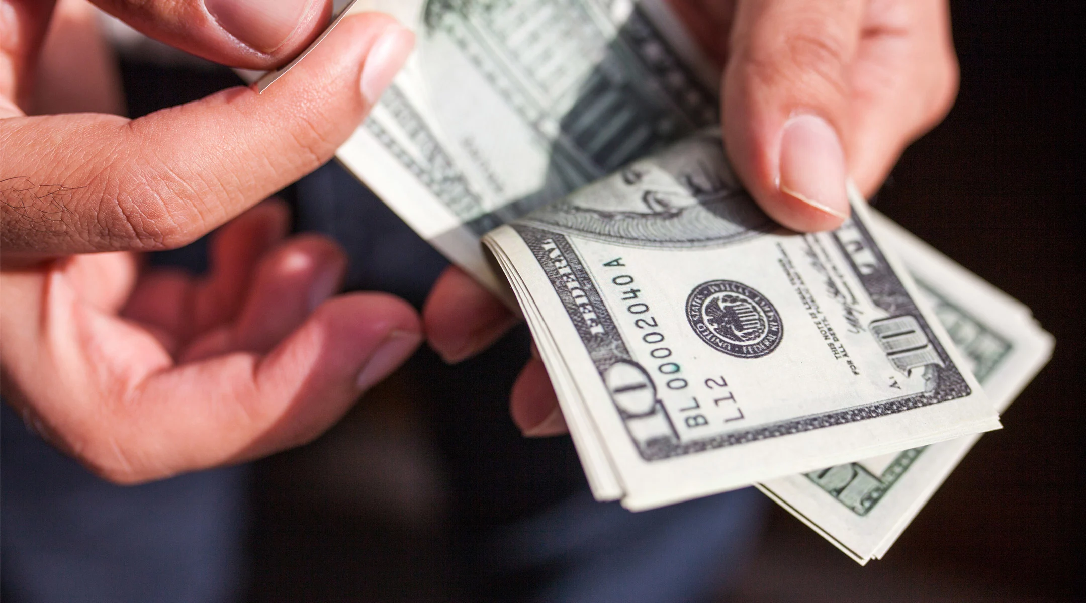 hand counting out money