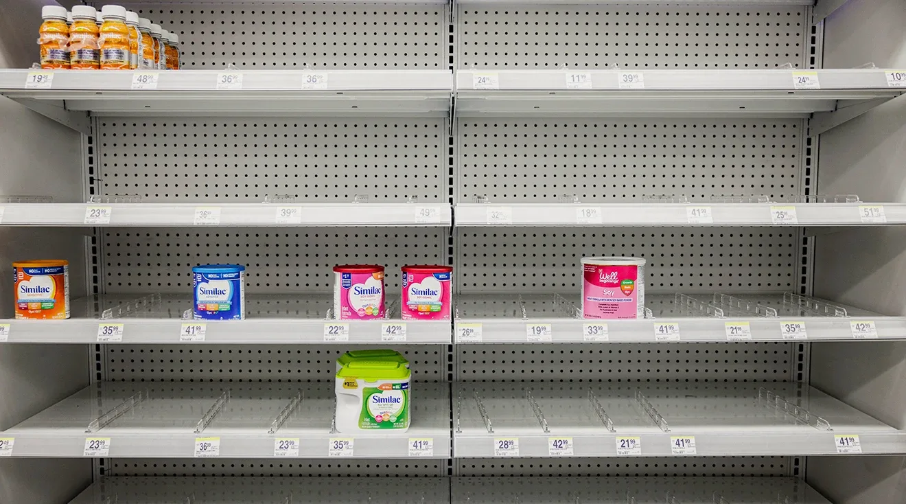 Shelves normally meant for baby formula sit nearly empty at a store in downtown Washington, DC, on May 22, 2022