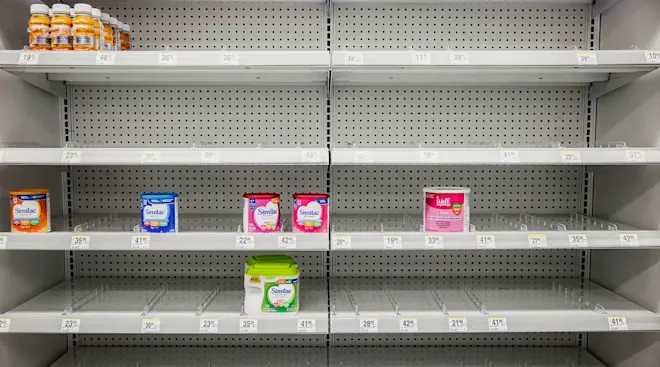 Shelves normally meant for baby formula sit nearly empty at a store in downtown Washington, DC, on May 22, 2022
