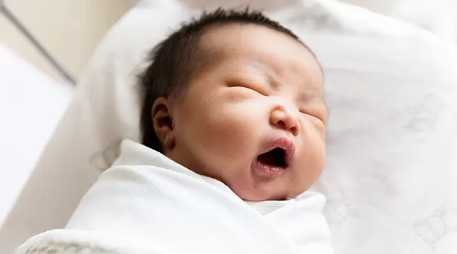 newborn baby yawning 
