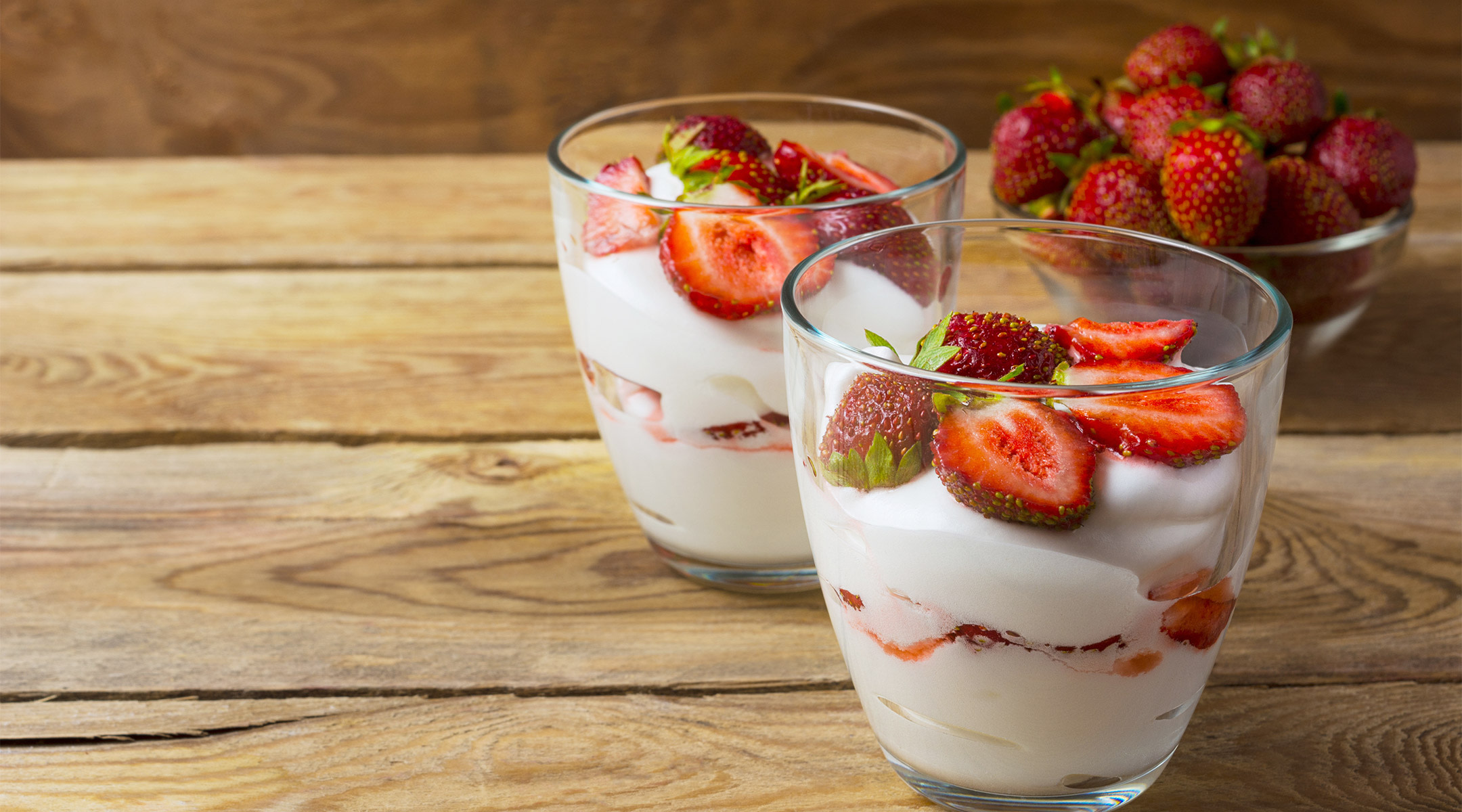 Healthy snack for pregnant women, yogurt and strawberries
