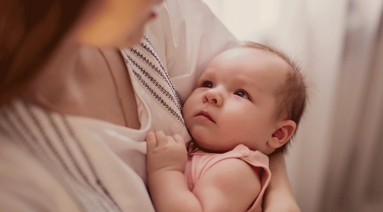 mother singing lullaby to baby