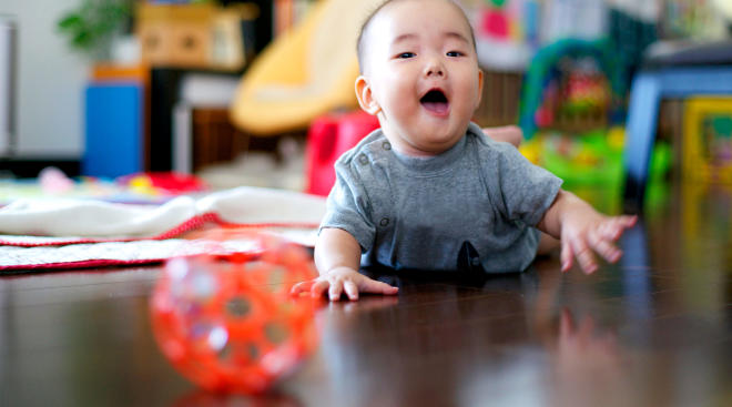 happy active baby doing tummy time