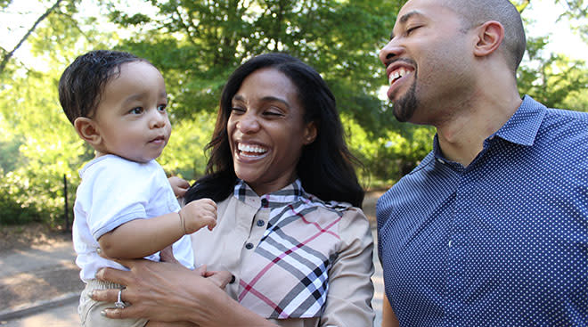Charles S. Johnson pictured with his late wife, Kira and their baby son. 