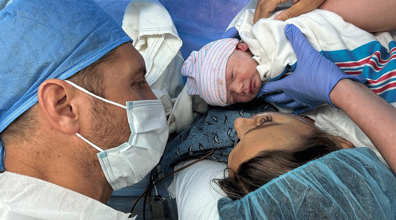 Jana Kramer and Allan Russell in delivery room with newborn baby